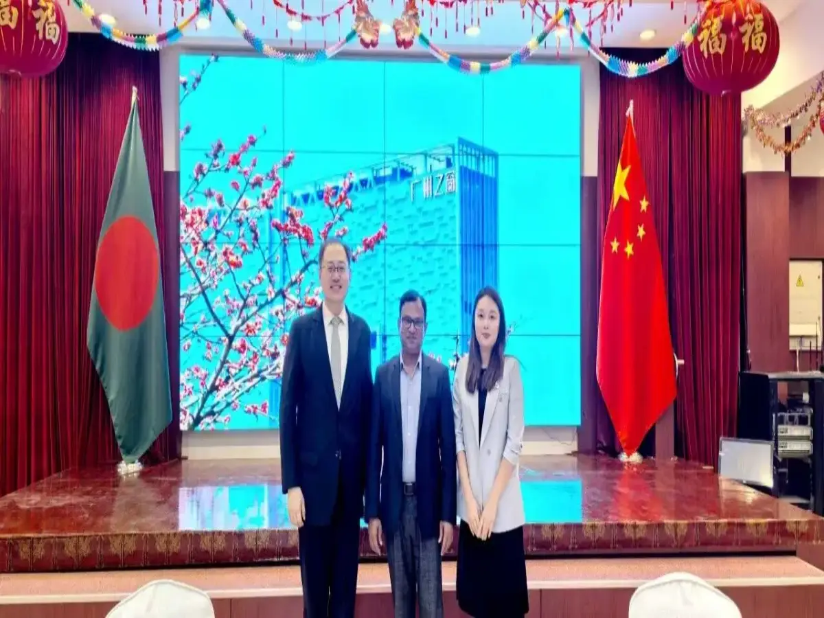 Chinese Ambassador to Bangladesh Yao Wen, Bangladeshi official, and Crostars Business Director Zhang Yan at Dhaka send-off press conference for drone training programme, Bangladesh and Chinese flags in background, August 13, 2025