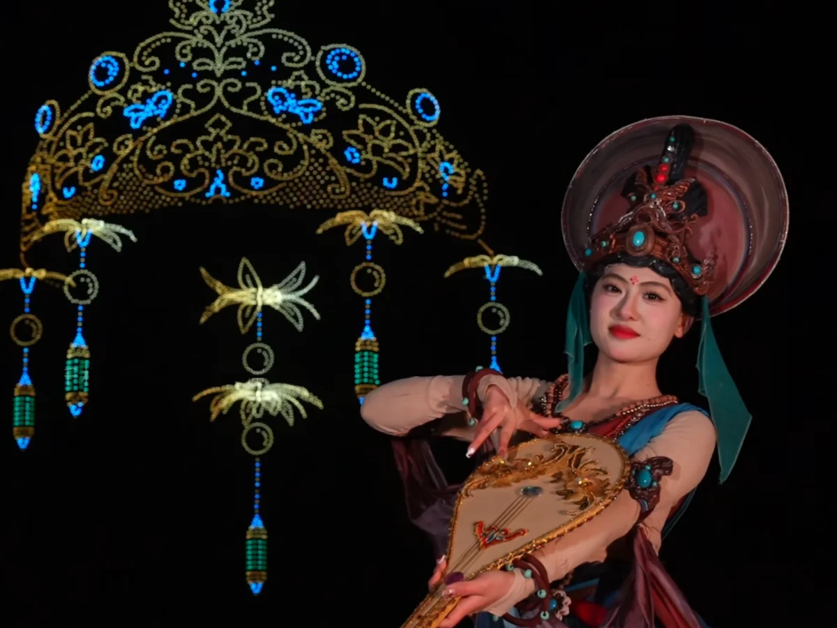 Crostars 10,000 drones forming Dunhuang Feitian crown alongside traditional dancer for Lunar New Year, 2026