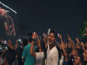 Crostars 2,500 drones forming Bangladesh Friendship text and portrait above cheering crowd in Dhaka