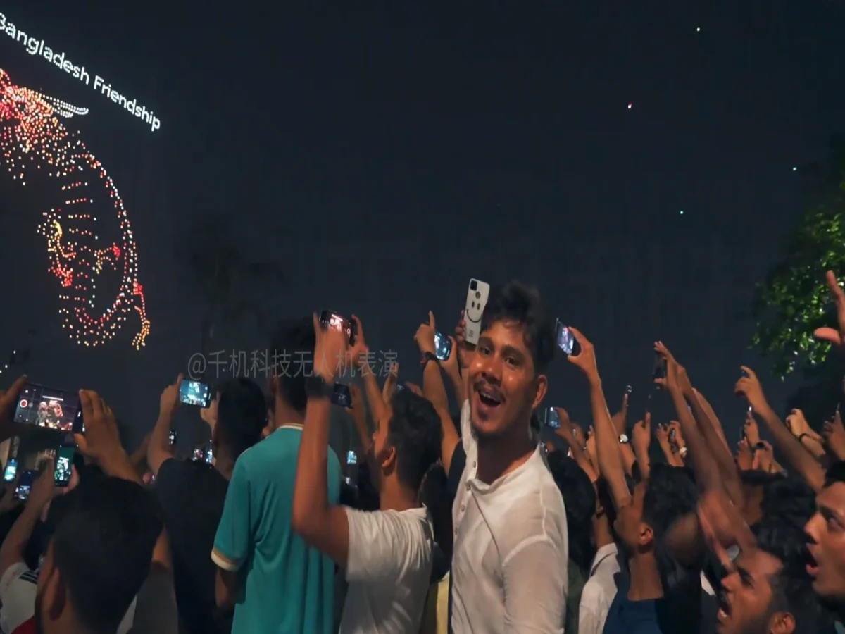 Crostars 2,500 drones forming Bangladesh Friendship text and portrait above cheering crowd in Dhaka
