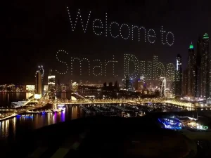Crostars drones forming 'Welcome to Smart Dubai' text above Dubai Marina skyline, 2023