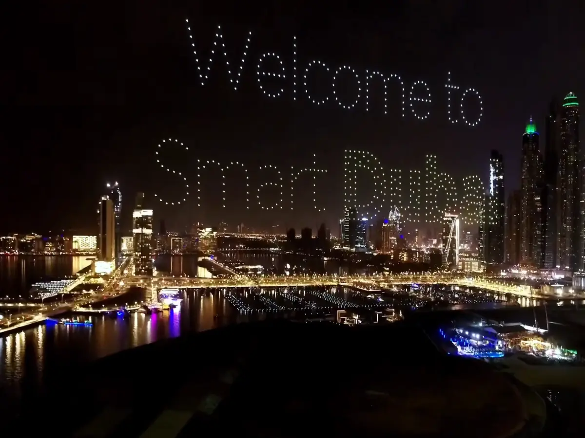 Crostars drones forming 'Welcome to Smart Dubai' text above Dubai Marina skyline, 2023