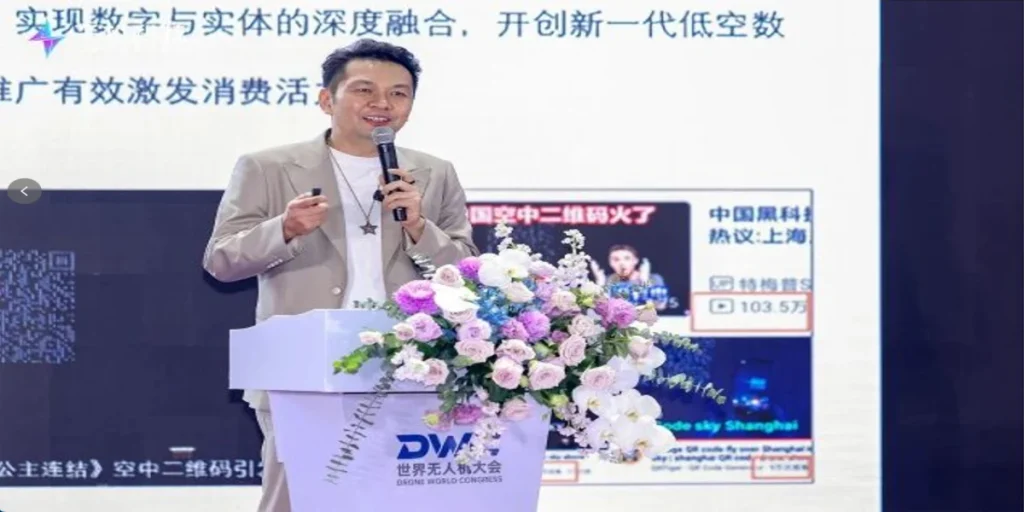 Shi Zheyuan speaking on stage at a Drone World Congress 2026 forum in Shenzhen